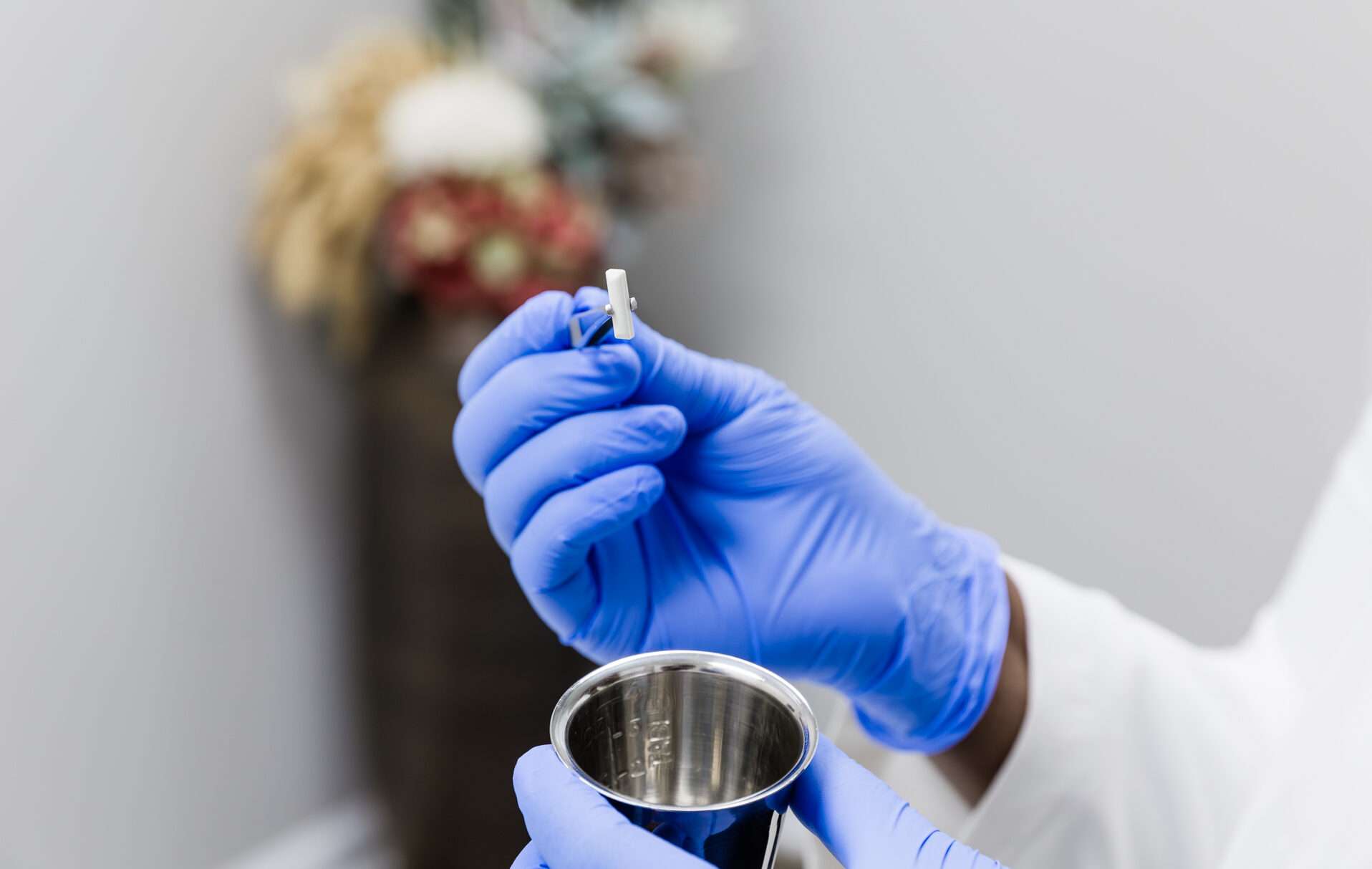 Physician holding a hormone pellet for BHRT treatment.
