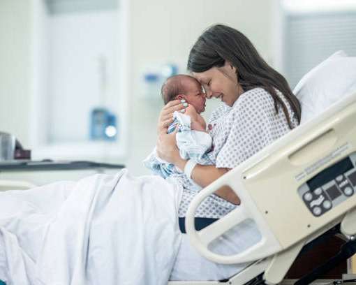 Confident Mom after childbirth in San DIego