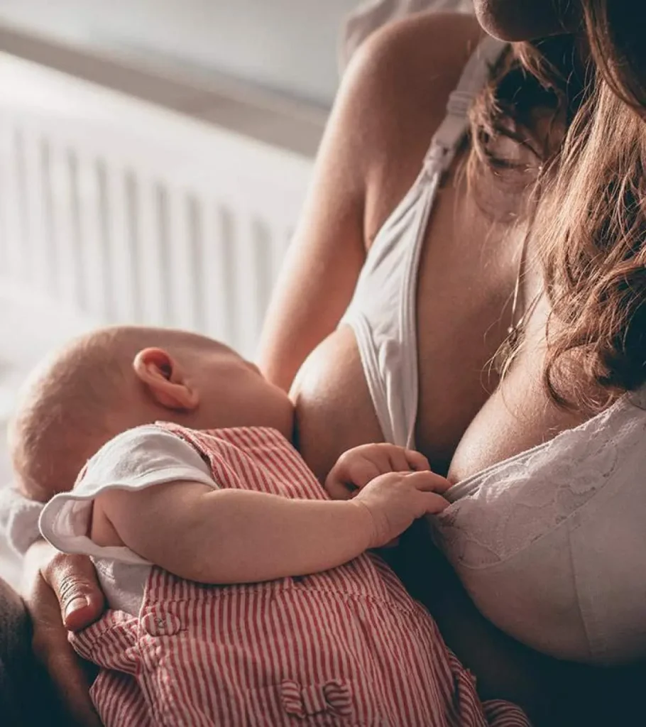 woman smiling after fat transfer breast lift restoring breast volume after breastfeeding in San Diego