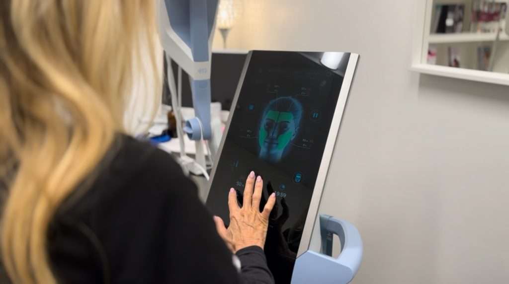 Lisa performing EMFACE facial lifting treatment at Allurant Medical Spa San Diego