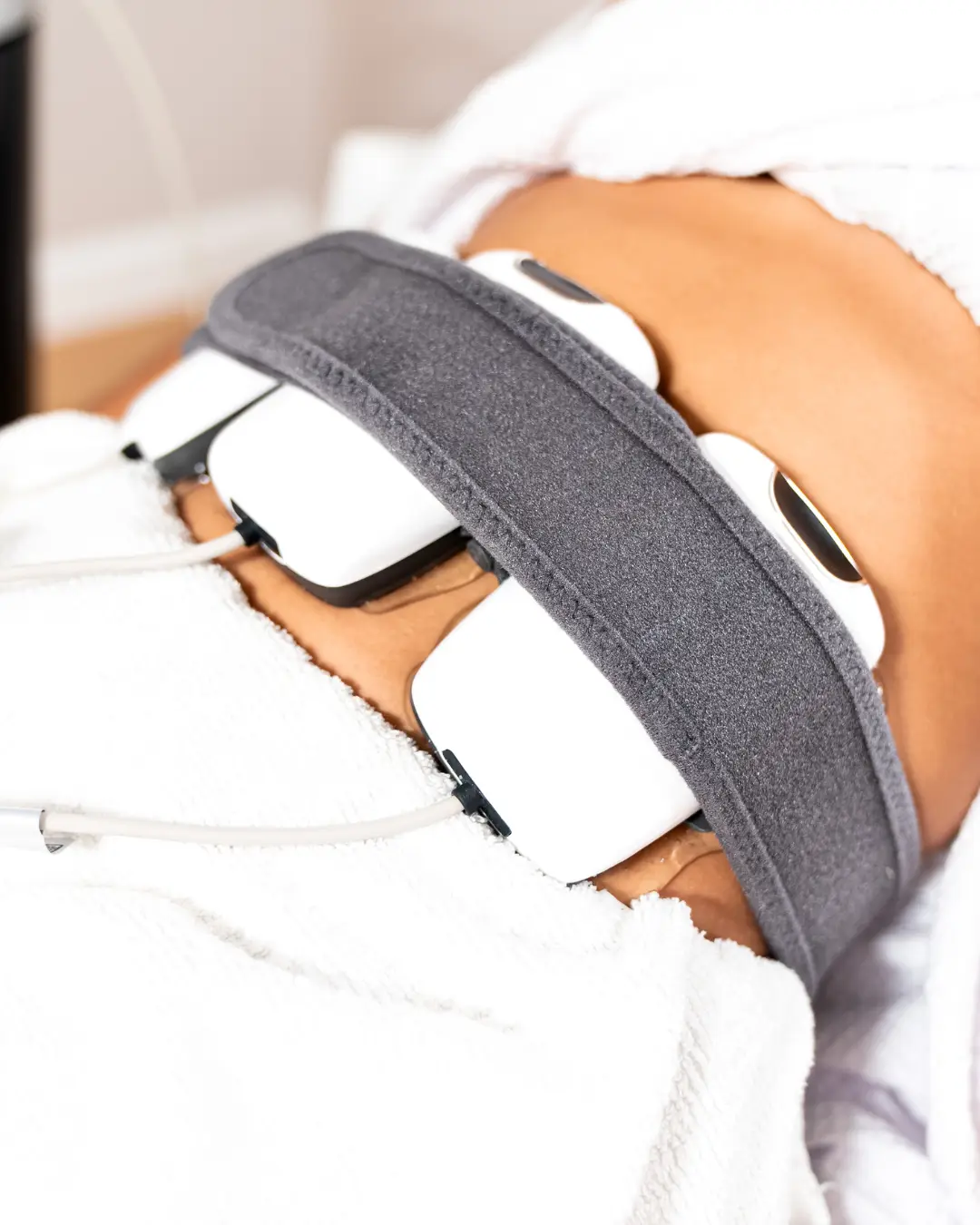 Evolve Tone EMS muscle stimulation treatment on the abdomen at Allurant Medical Spa San Diego