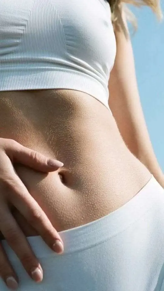 Patient showing natural body contouring results after Evolve Transform fat reduction and muscle toning in San Diego