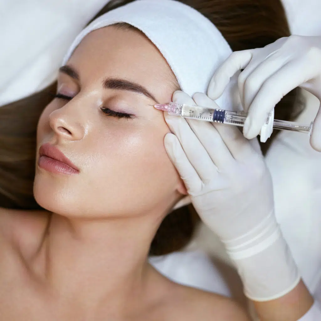 Dr. Kat Khorrami, MD discussing Sculptra and dermal fillers during a consultation in San Diego