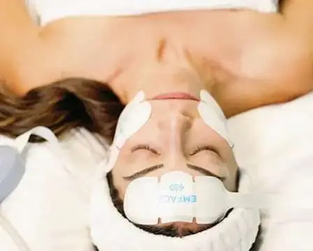 Woman with visibly lifted brows and firm facial skin after completing a series of EMFACE collagen stimulation treatments at a Carmel Valley medical spa