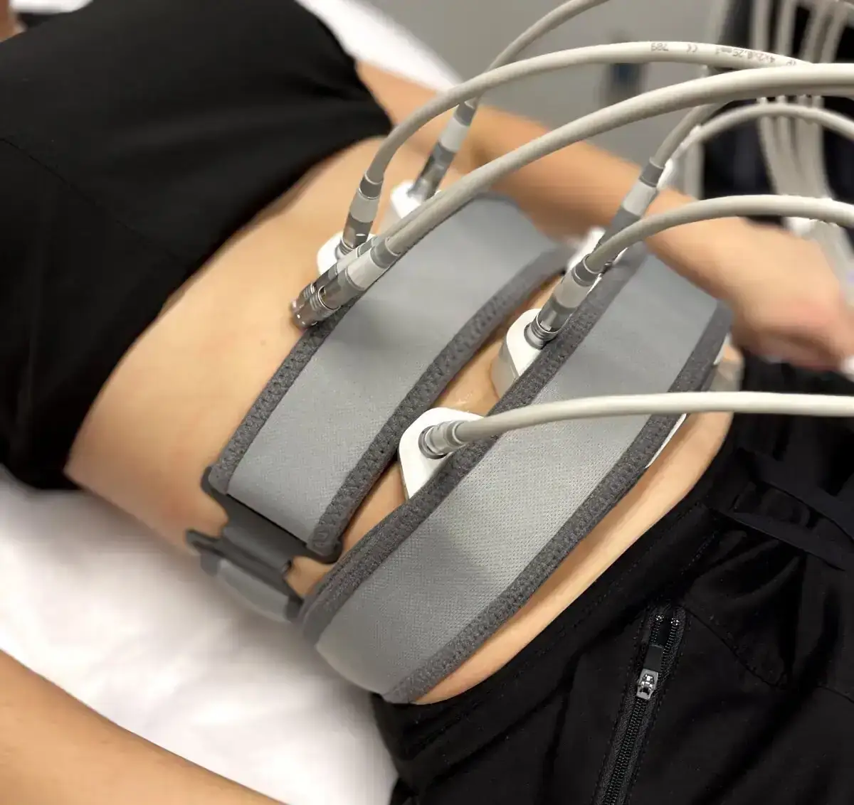 Non surgical abdominal body contouring with Evolve X electrical muscle stimulation at Allurant Medical Spa San Diego