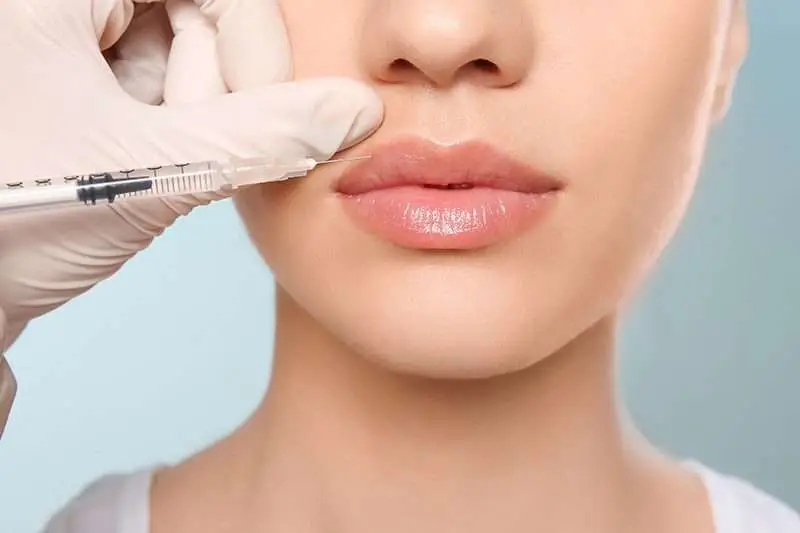 Provider at Allurant Medical Spa in Carmel Valley San Diego reviewing injectable treatment options with a patient during a cosmetic consultation