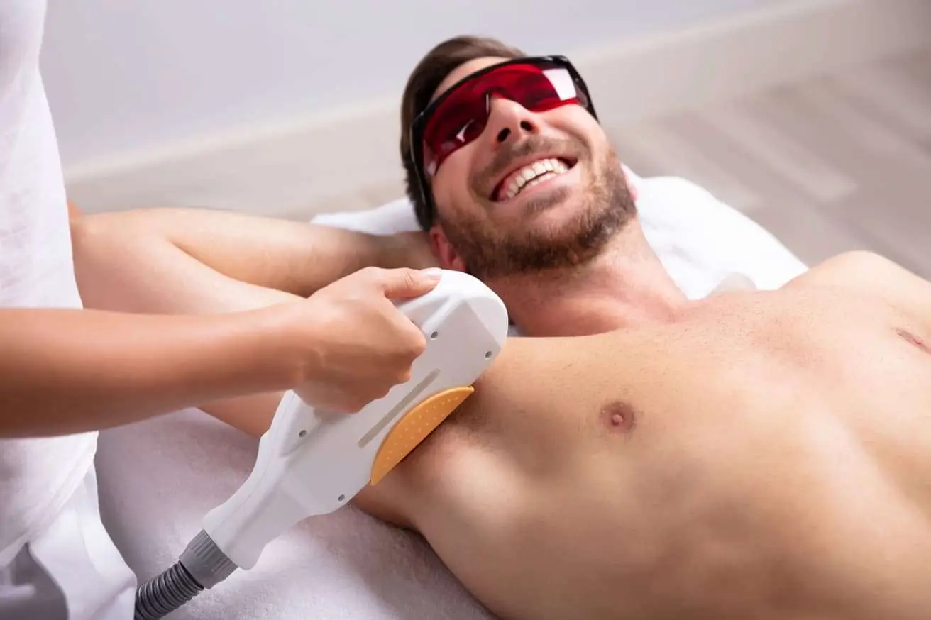 Dr. Kat Khorrami, MD consulting with a male patient about laser hair removal