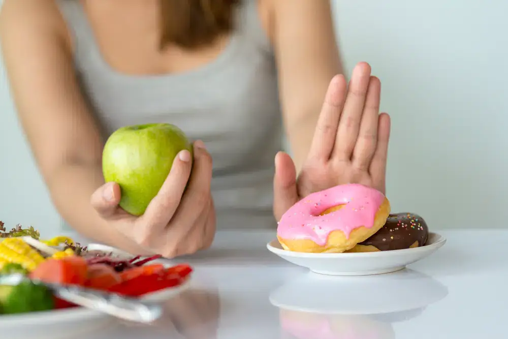 Patient reviewing a healthy meal plan at a physician-directed medical weight loss consultation in San Diego