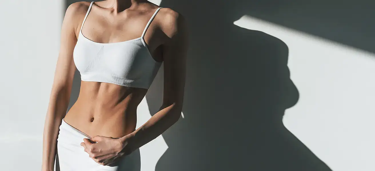 Female patient toned abs abdomen body contouring results Allurant Medical Spa San Diego