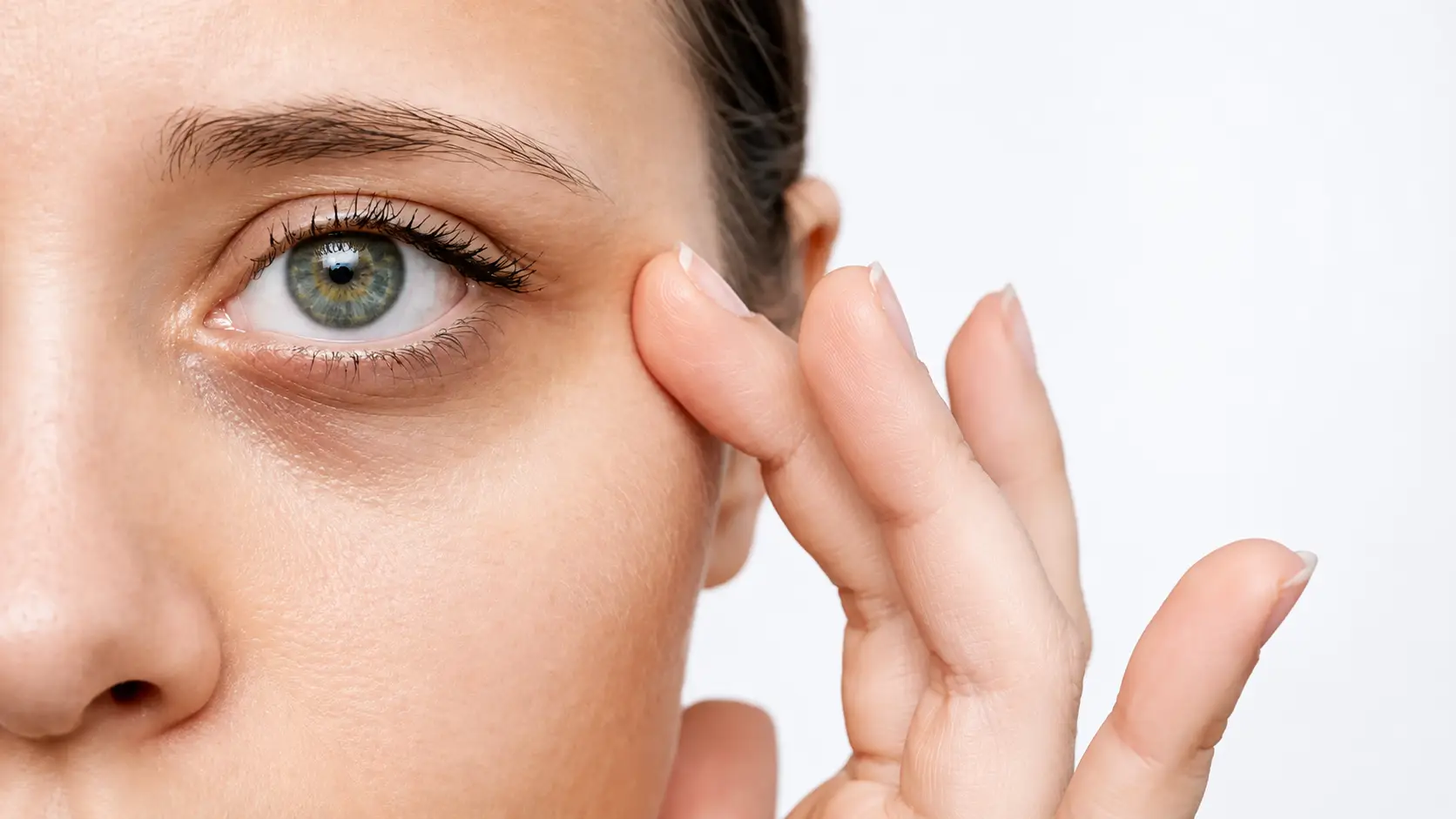 Patient evaluating dark circles before a personalized PRF Under Eyes consultation at Allurant Medical Spa in San Diego for natural under eye rejuvenation.