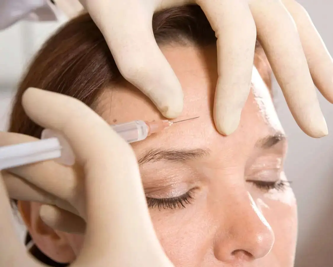 Provider evaluating facial anatomy before Botox treatment to help prevent Botox Gone Bad and achieve natural-looking results.