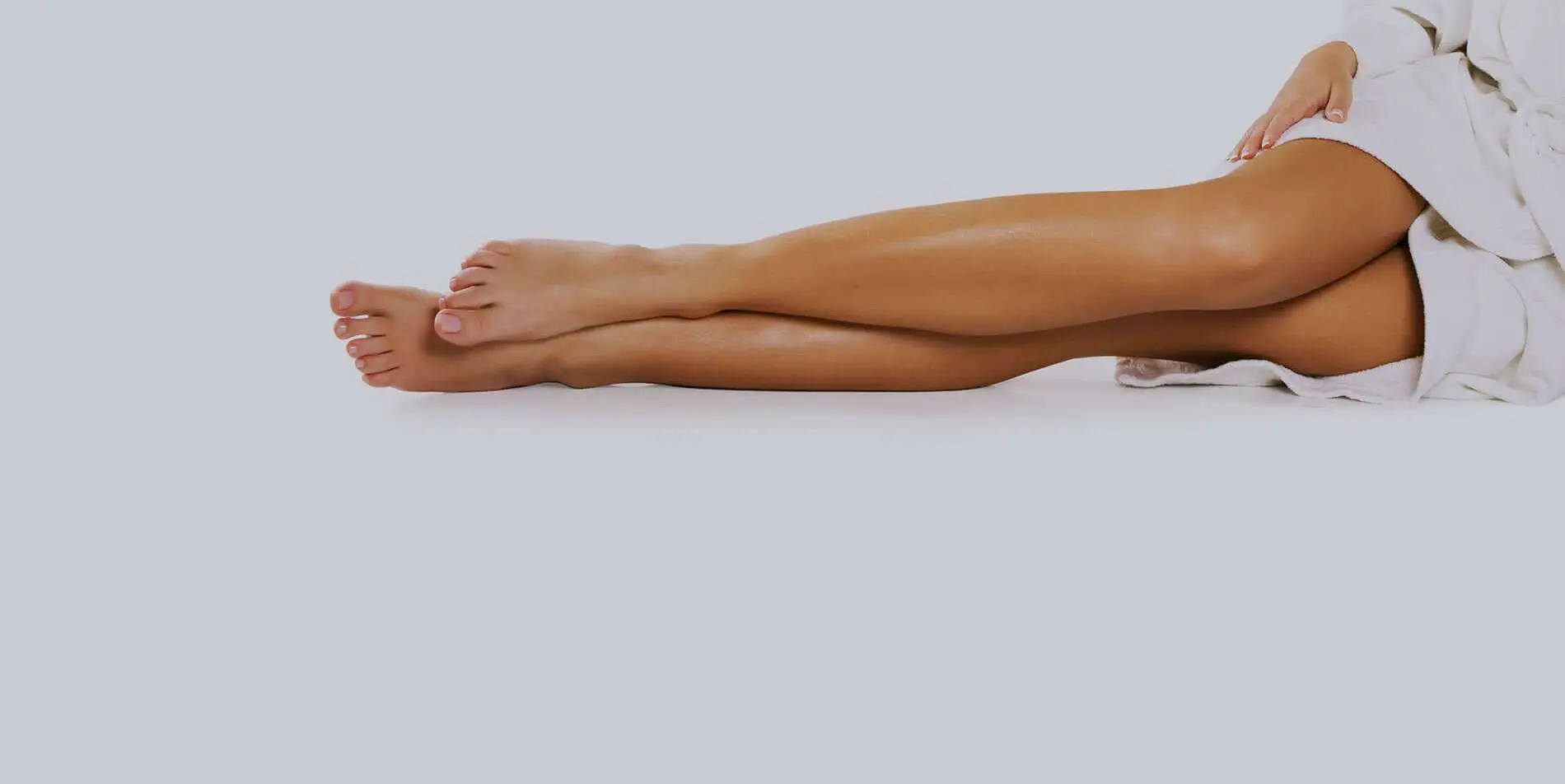 Patient showing smoother, healthier looking legs after personalized leg treatments at Allurant Medical Spa in San Diego.