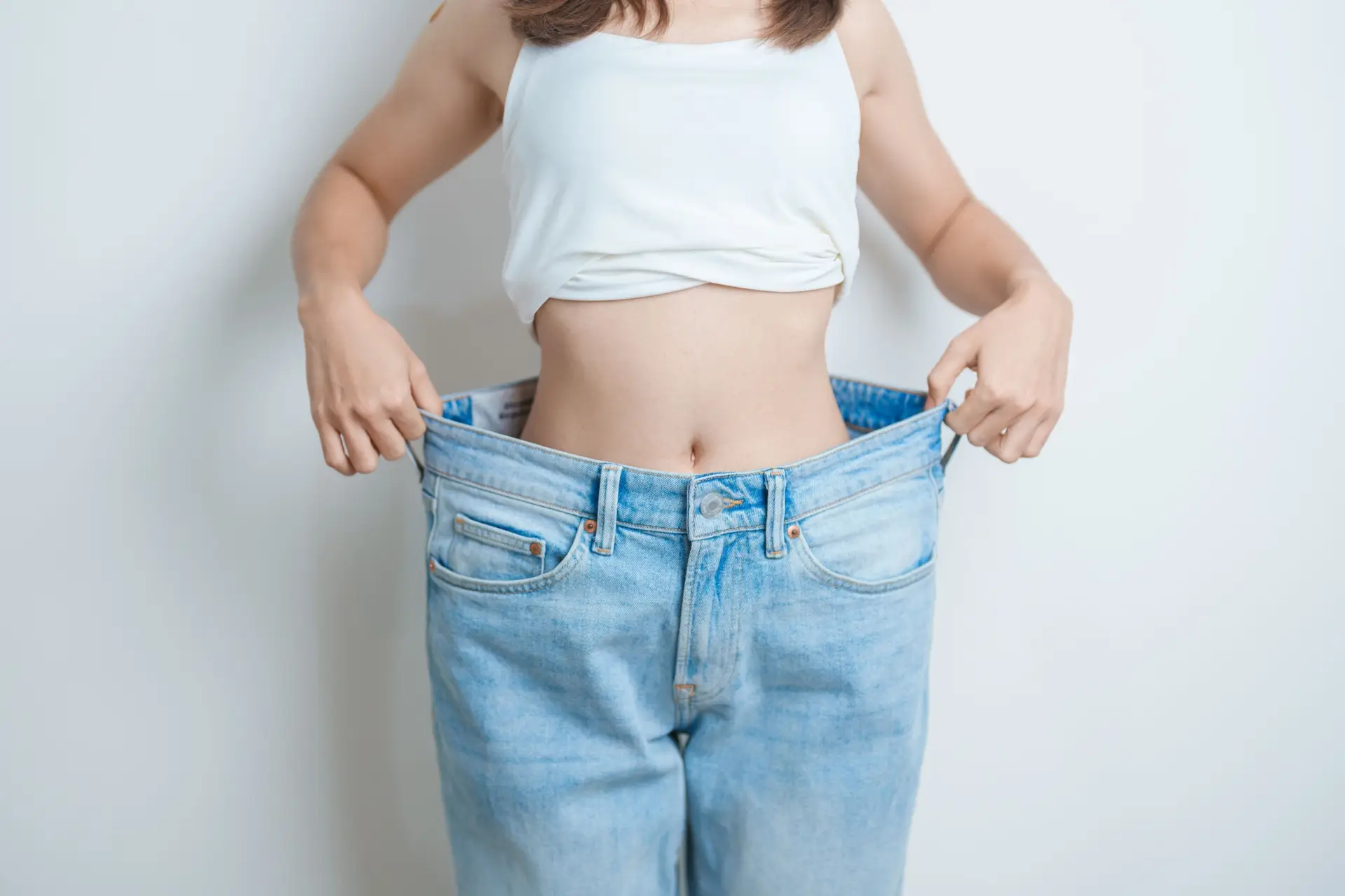 Patient discussing visceral fat vs subcutaneous fat treatment options at Allurant Medical Spa