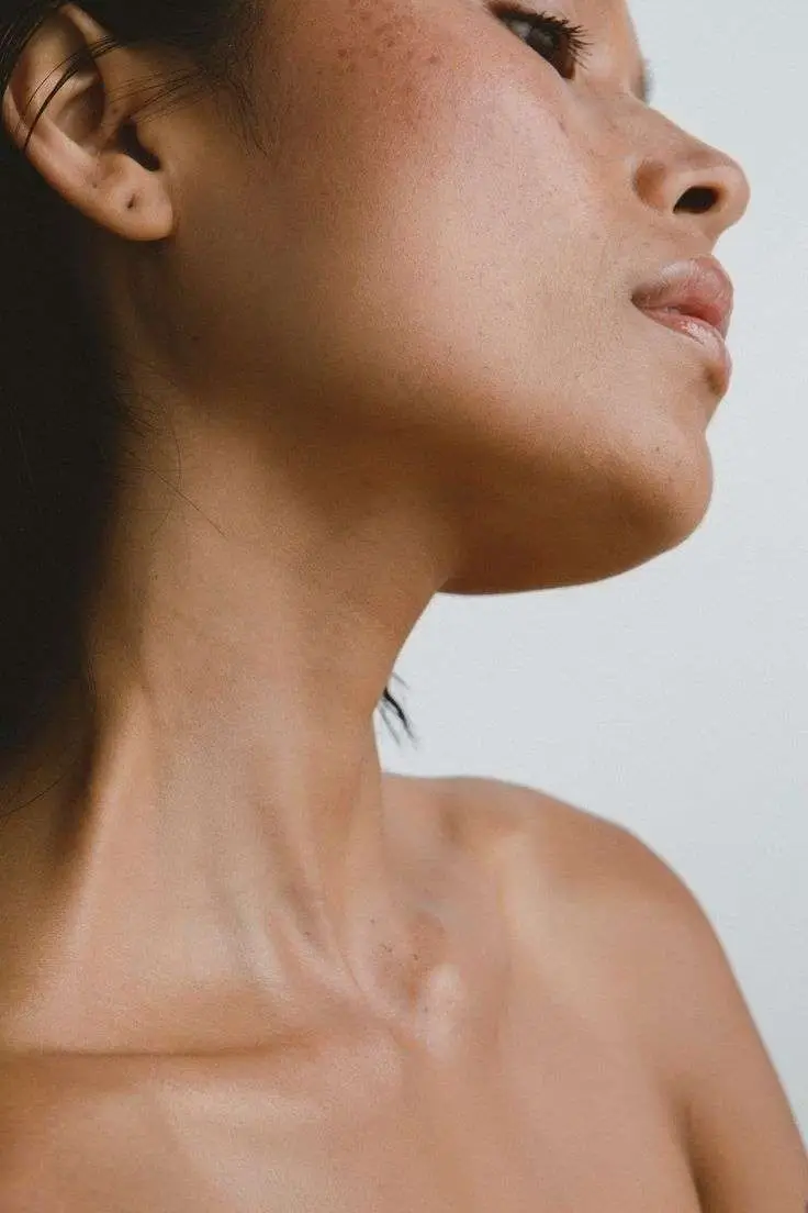 Patient showing natural jawline contouring results after personalized treatment at Allurant Medical Spa