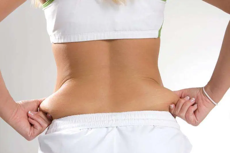 Woman with love handles considering non surgical treatment for love handles in San Diego