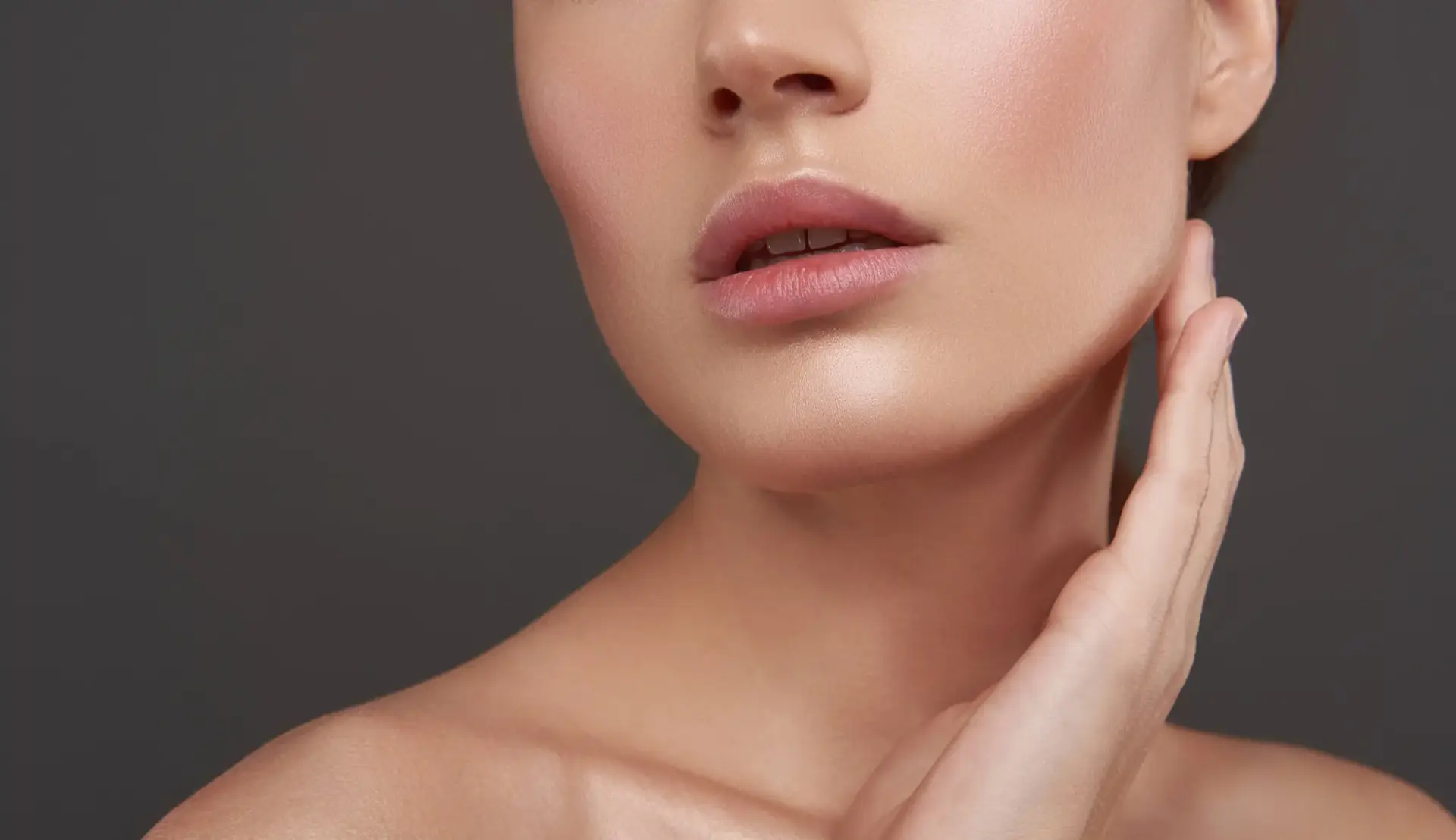 Patient evaluating jawline before nonsurgical jawline contouring consultation at Allurant Medical Spa in San Diego
